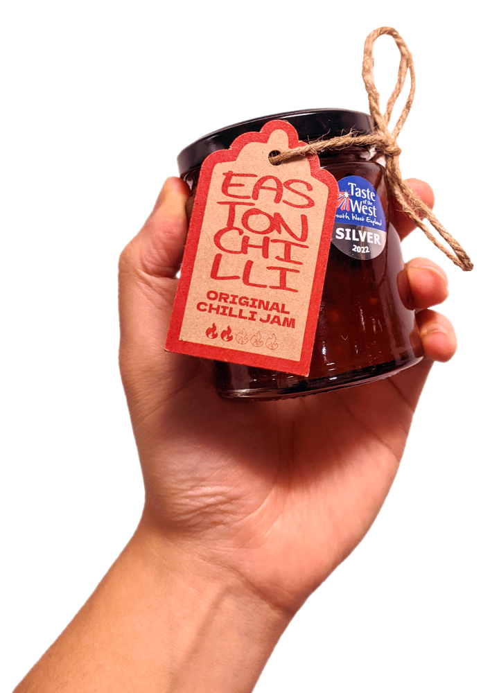 Hand holding jar of Easton Chilli jam